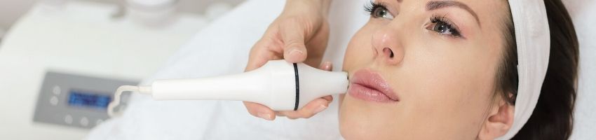 A woman having a lip lightening treatment