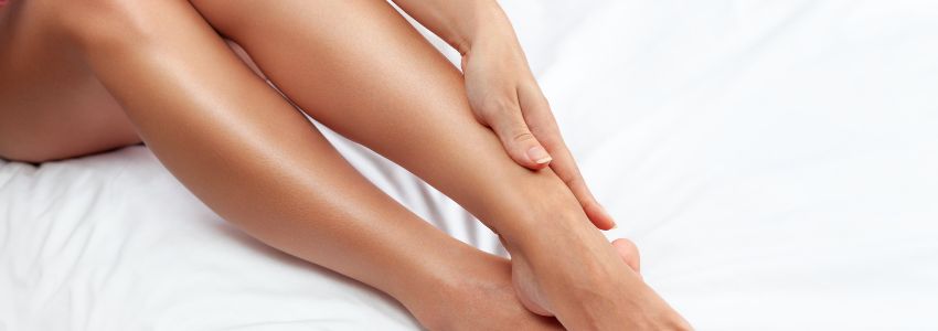 The woman has smooth legs because of laser hair removal.